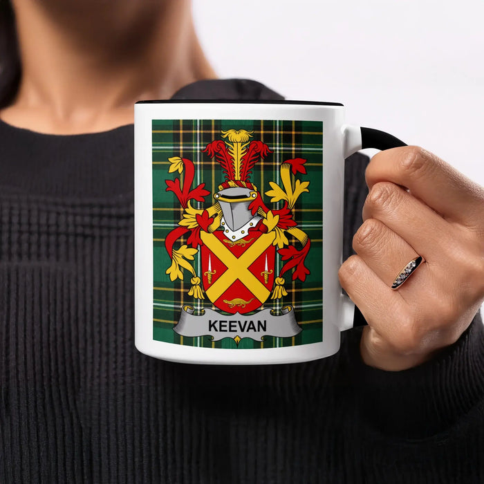 Keevan crest on a black-handled mug with a tartan background.