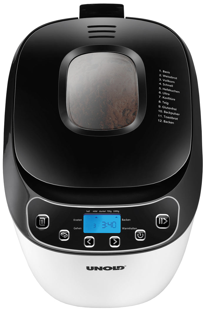 Der Unold AG 680101 Backmeister Design (B-Ware) Brotbackautomat verfügt über ein schwarz-weißes Design, ein digitales Display, Bedientasten, ein Sichtfenster, das das Innere des Teigs zeigt, und eine Liste der deutschen Programmoptionen oben rechts.