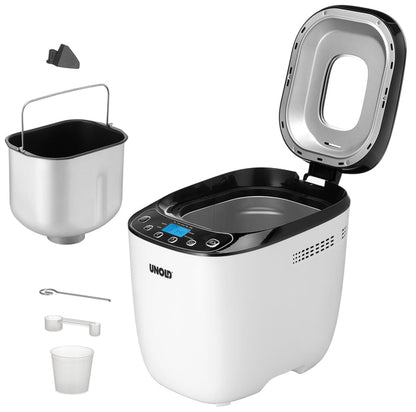Der Brotbackautomat Unold AG 680101 Backmeister Design (B-Ware) in Weiß und Schwarz ist mit geöffnetem Deckel abgebildet, der den Blick auf die leere Backkammer freigibt. Daneben befinden sich eine herausnehmbare Backform, ein Knethaken, ein Messbecher, ein Löffel und ein kleines schwarzes Teil.