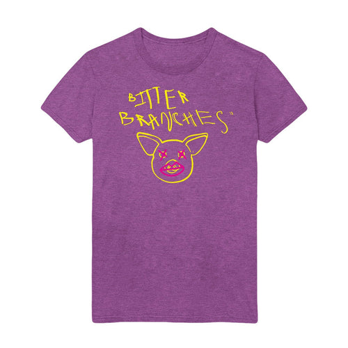Purple tshirt with scratchy style yellow text reading Bitter Branches on the top part of the shirt with a yellow outline of a pig face below. Pink Xs are drawn over the pig's eyes and pink lips are drawn over the pig's snout.