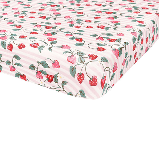 Corner of the Crib Sheet in Strawberry Fields shown on a crib mattress