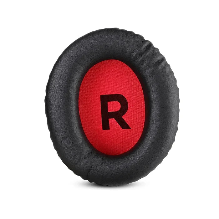 Circular black ear cushion with a red center displaying the letter ’R’.