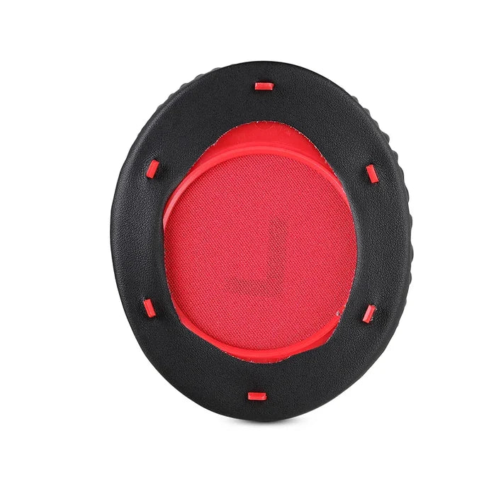 Circular ear cushion with a red center and black outer ring.