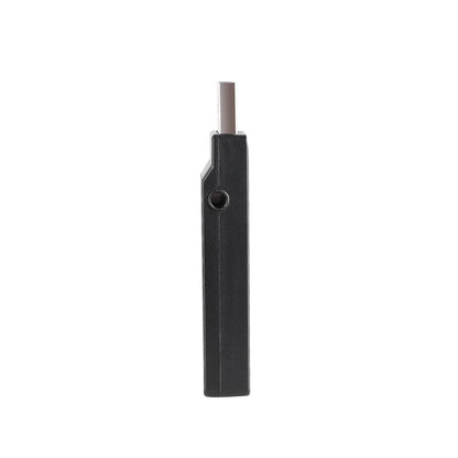 Black rectangular electronic device with a protruding metal tip.