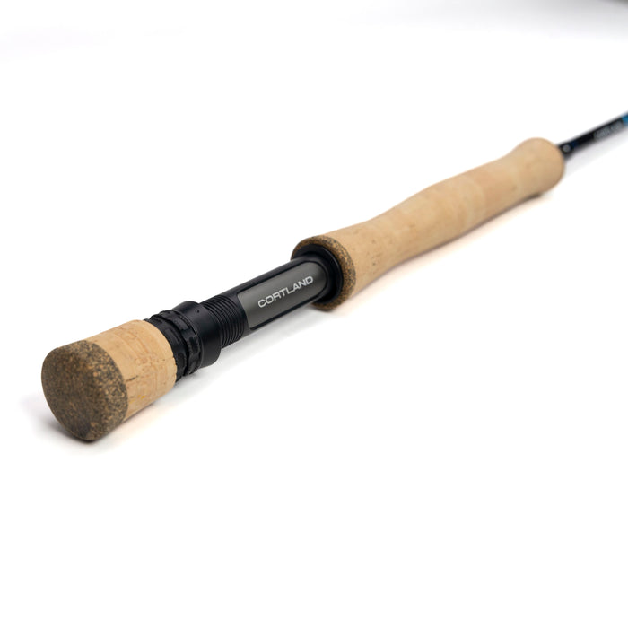 Fishing rod with cork handle and black reel on a white background