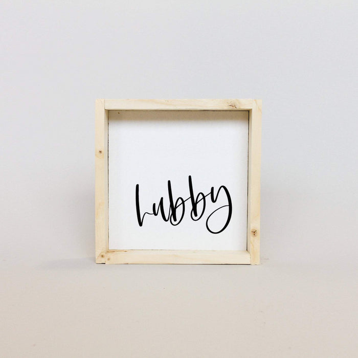 white hubby shelf sign