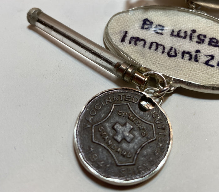 Statemeant2020 sterling silver, vintage snakebite kit, hand embroidered wool, canine vaccination tag