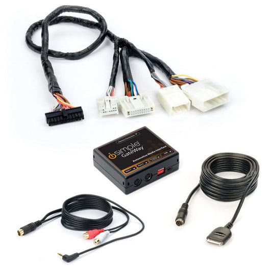 The image shows a black iSimple GateWay Kit which includes a box-like device with various connectors and cables: an iPod cable, auxiliary input cable, and vehicle harness.