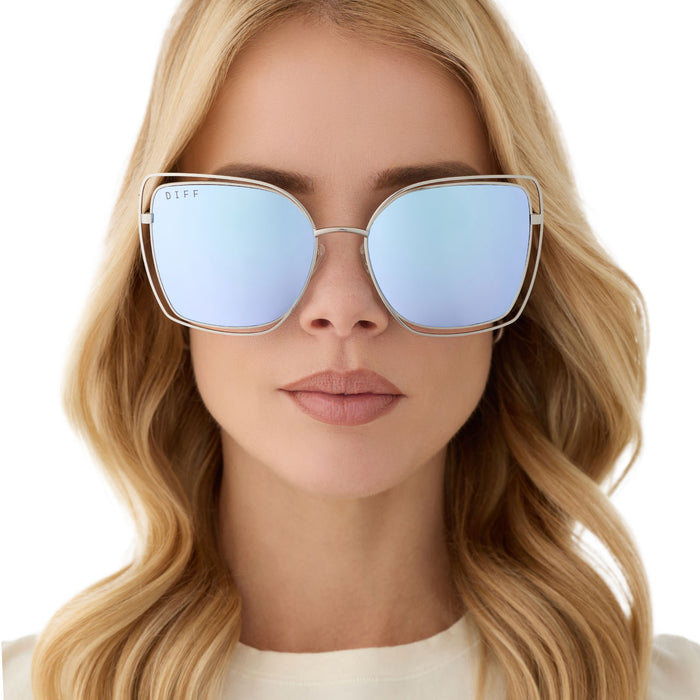 on model - female wearing diff eyewear featuring the jacqueline square sunglasses with a silver thistle temple tips frame and lavender mirror lenses front view