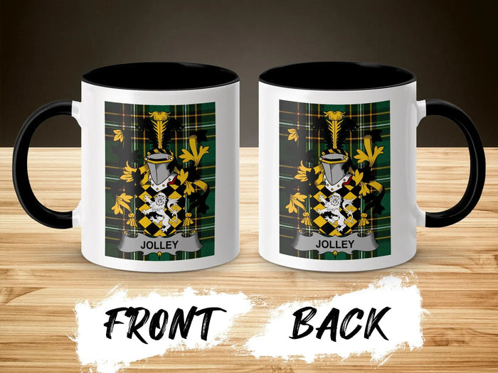 Two sides of a Jolley crest mug with black handle and rim, on a wooden surface.