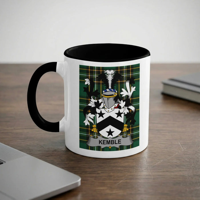 Mug with Kemble family crest on a wooden desk.