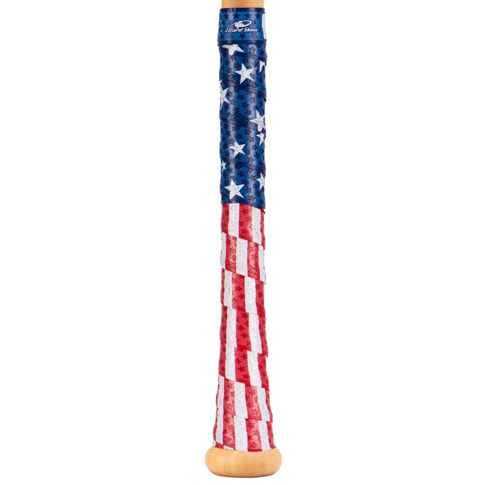 The Lizard Skins Specialty 1.1mm Durasoft Polymer Bat Grip features white stars on blue and red-and-white stripes for an American flag look, offering a comfortable, secure hold with durable Durasoft Polymer material.