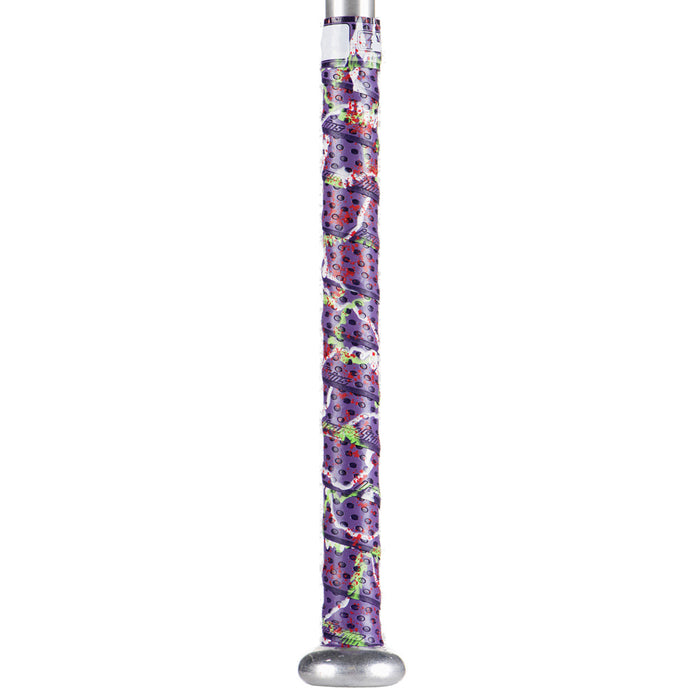 A metal baseball bat features a Lizard Skins Specialty 1.1mm Durasoft Polymer Bat Grip in purple with a colorful, cartoon-style design—eyes and whimsical patterns—covering most of the handle for comfort and style.