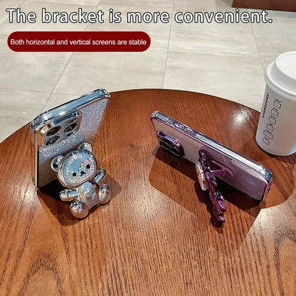 Phone stand in the shape of a cute cartoon bear character.
