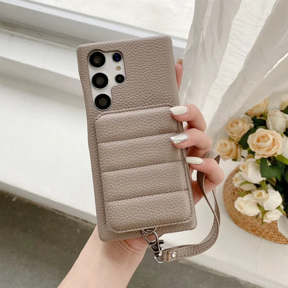 Beige leather phone case with multiple camera cutouts and a wrist strap.