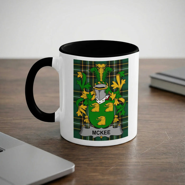 White mug with black handle featuring the McKee family crest.