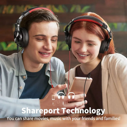 Two smiling young people wearing headphones and looking at a shared mobile device.