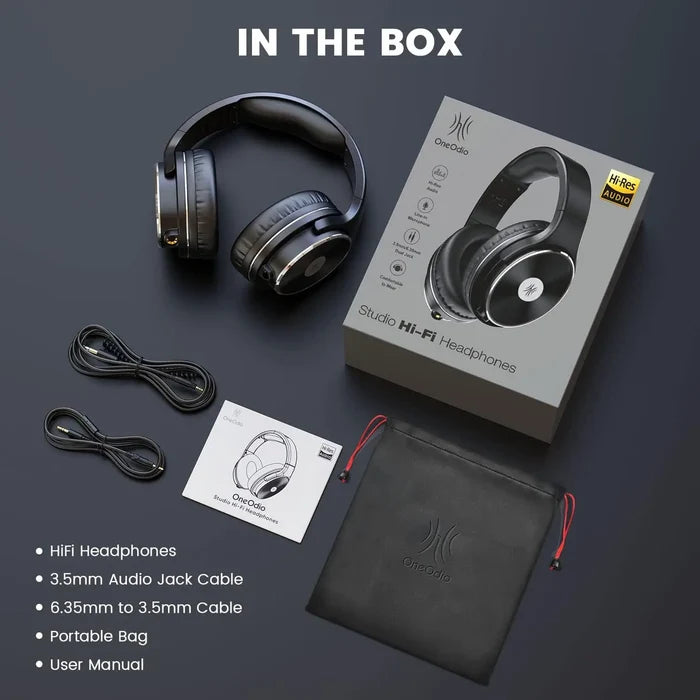 Pair of over-ear wireless headphones with their packaging and accessories.