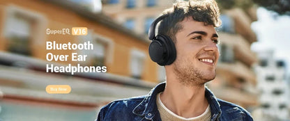 Wireless over-ear headphones worn by a smiling young man outdoors.