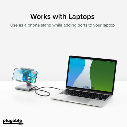 Plugable UDS-7IN1 hub functioning as a phone stand while connected to a laptop via USB-C.