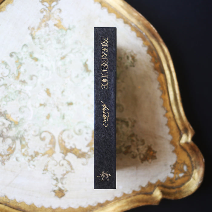 Special Edition of Pride and Prejudice by Jane Austen with gold and white illustration of Elizabeth and Mr. Darcy on a black hardcover book and a slip case
