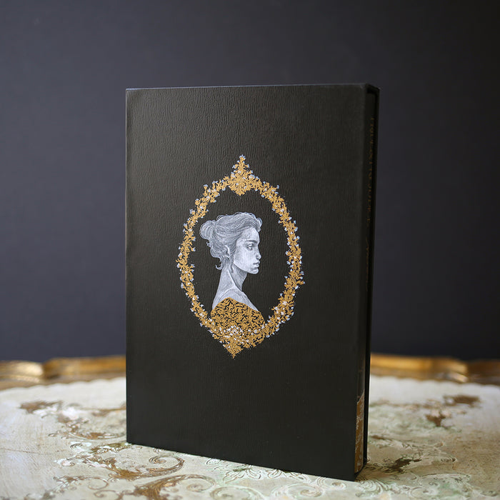 Special Edition of Pride and Prejudice by Jane Austen with gold and white illustration of Elizabeth and Mr. Darcy on a black hardcover book and a slip case