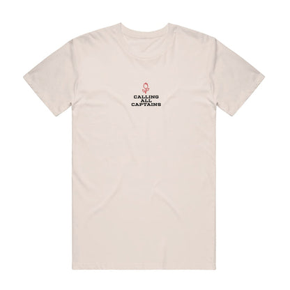 Cream colored short sleeve shirt with CALLING ALL CAPTAINS written across the chest in black font. Above the text there is a small red rose.
