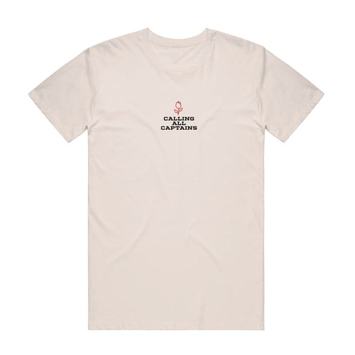Cream colored short sleeve shirt with CALLING ALL CAPTAINS written across the chest in black font. Above the text there is a small red rose.