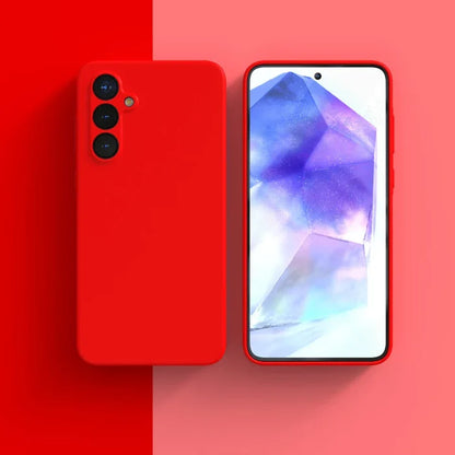 Red smartphone with triple rear cameras and a colorful display showing abstract shapes.