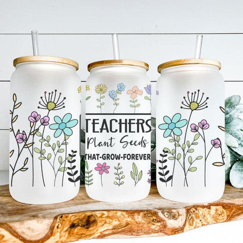 Libby Glass Can Tumbler with “Teachers Plant Seeds” phrase and colorful flower garden design, perfect teacher gift.