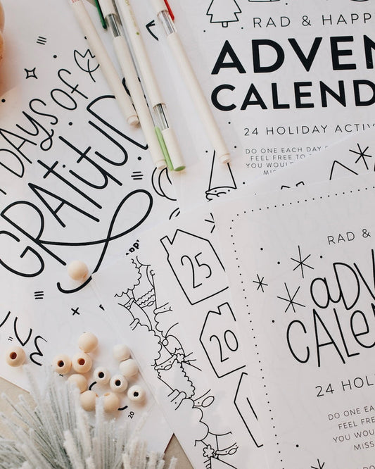 Advent calendar with Christmas-themed designs and decorative items on a white background