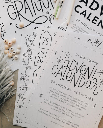 Advent calendar printouts with holiday activities on a neutral background