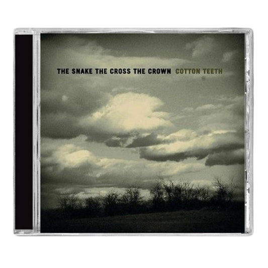 A CD case featuring a cloudy sky over a bleak landscape with THE SNAKE THE CROSS THE CROWN COTTON TEETH in bold uppercase, reflecting the brands moody, atmospheric rock style.