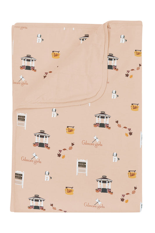 Beige blanket with Gilmore Girls pattern on a white background