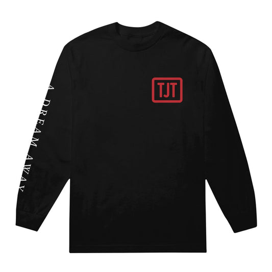 Black long sleeve shirt with a red box in the top corner with red text inside that says TJT. On one sleeve there is white text that says A DREAM AWAY.
