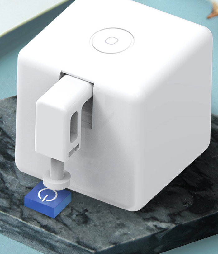 White cube-shaped button pusher.
