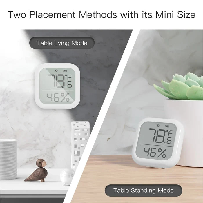 White digital thermometer displaying temperature and humidity.