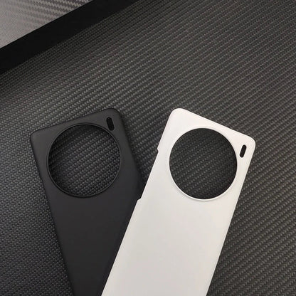Two smartphone cases with circular cutouts, one black and one white.