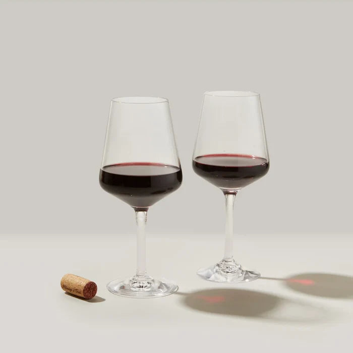 Set of two Simon Pearce Vintner Red Wine glasses with clear, elegant design and thin stems, perfect for enjoying red wine.