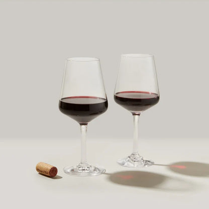 Set of two Simon Pearce Vintner Red Wine glasses with clear, elegant design and thin stems, perfect for enjoying red wine.