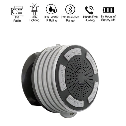 A black water-proof Bluetooth speaker with LED lighting and a suction cup, featuring icons indicating FM radio, lighting, and hands-free calling capabilities.